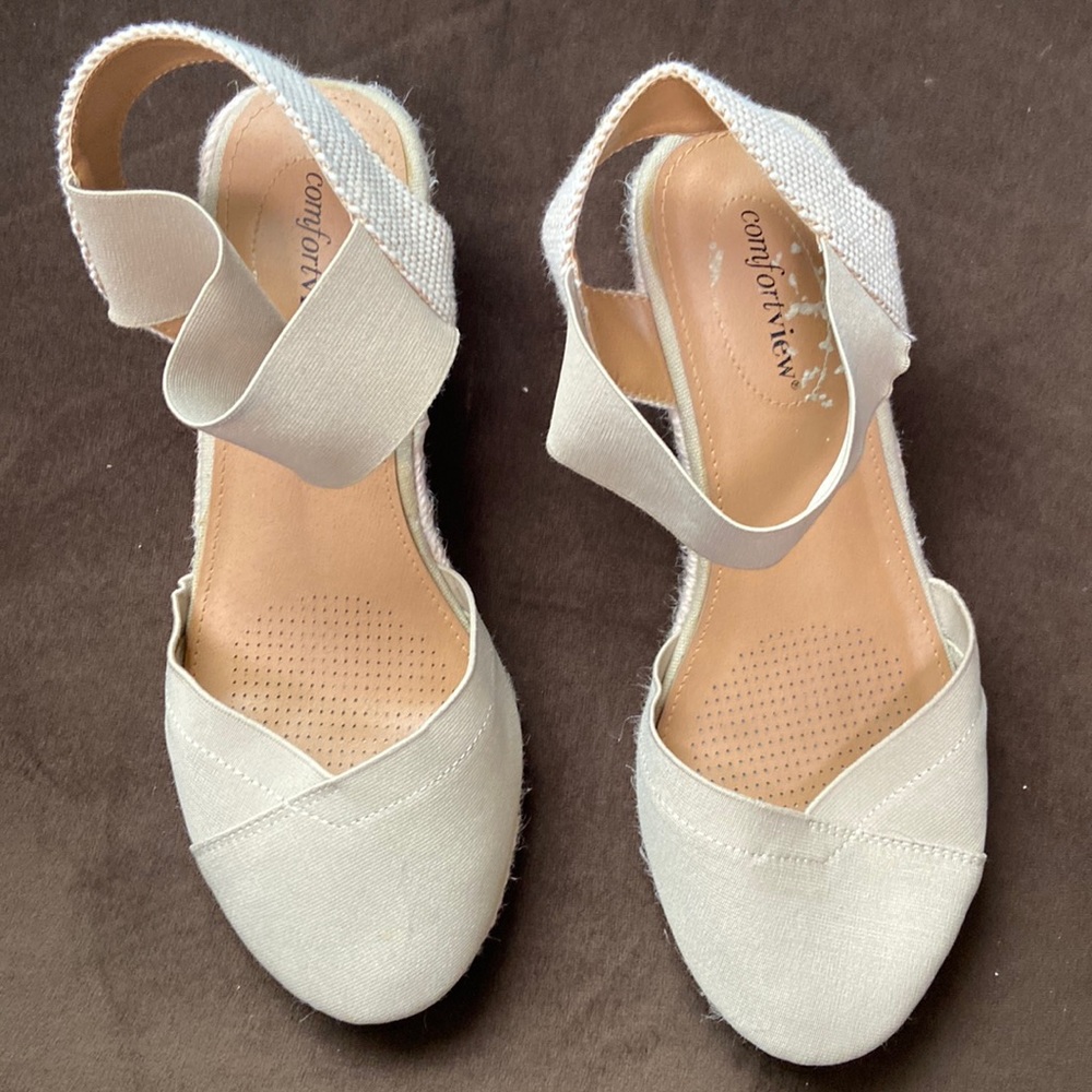 Cream colored size 9 espadrilles with a wedge heel